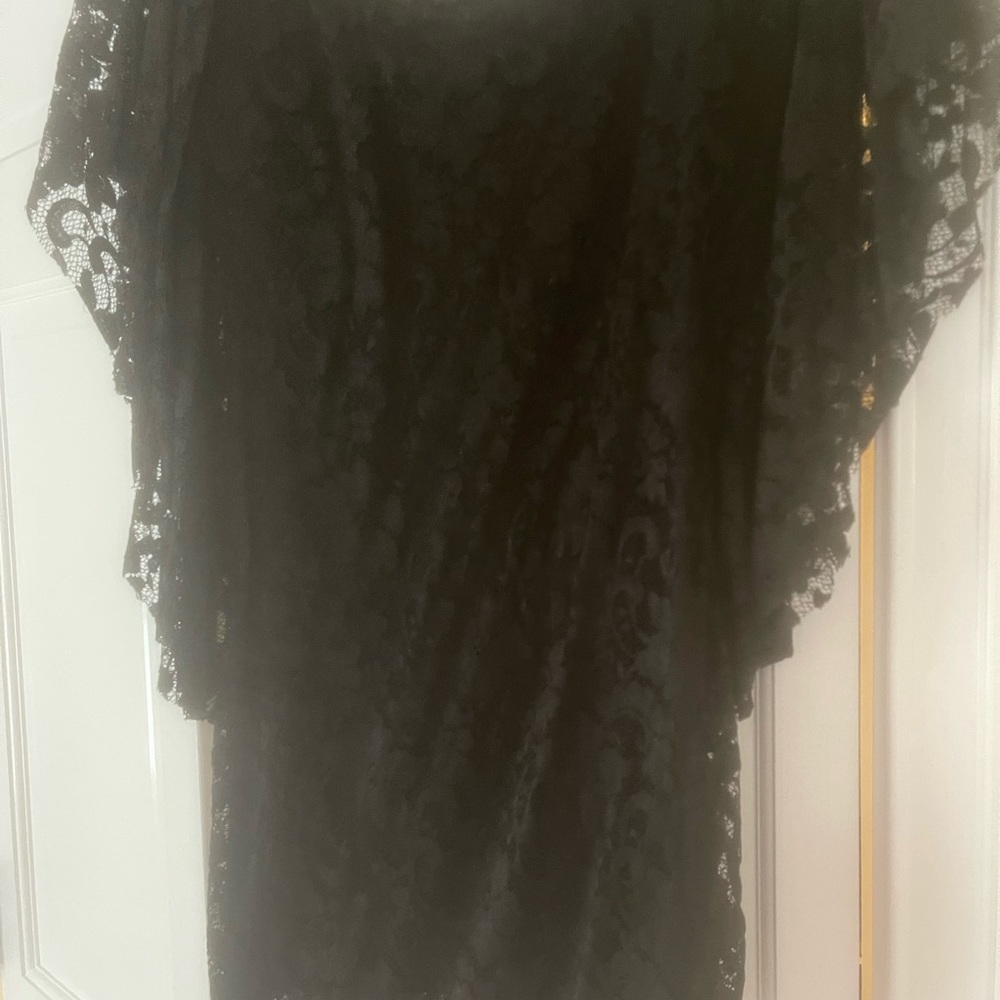 Lace black dress, back is open and detailed.